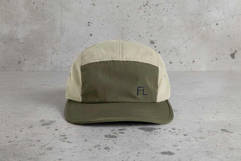 Two-tone cap with a logo on a white background